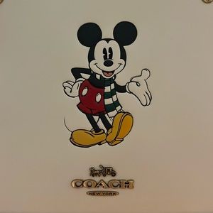 Brand new Coach purse with cute Mickey Mouse wearing a Christmas scarf